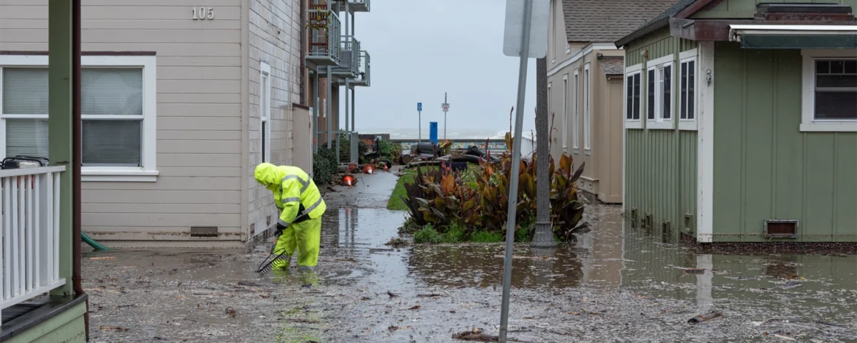 Californian house in Sacramento after rain with wet roof and overflowing gutters